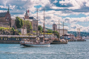 Akershus Fortress in Oslo at summer day with boats clipart