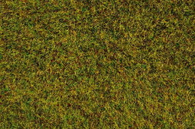 Kestirilmiş parlak yeşil yapay çimlerin dokusu