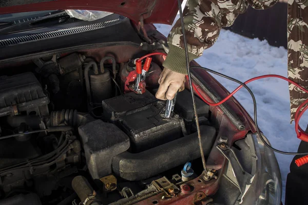 Firing the car in the winter by the jumper cables.