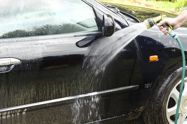 Washing car door.