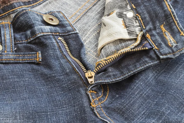 Bakgrunden texturerat dragkedja jeans byxor denim tyg — Stockfoto