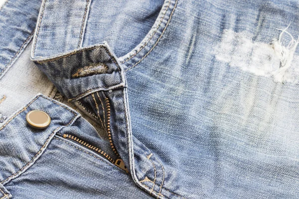 Bakgrunden texturerat dragkedja jeans byxor denim tyg — Stockfoto