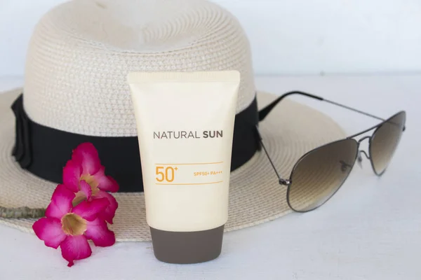 natural sun cosmetics for skin face sunscreen spf50 accessories of woman on white