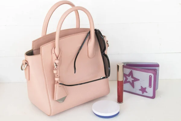 pink handbag collection colorful fashion woman with accessories on white