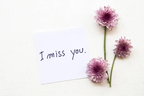 i miss you message card with flower on background white