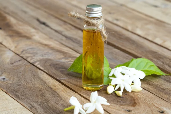 natural herbal oils extract flower jasmine smells scents aroma  local flora of asia arrangement flat lay style on background wooden