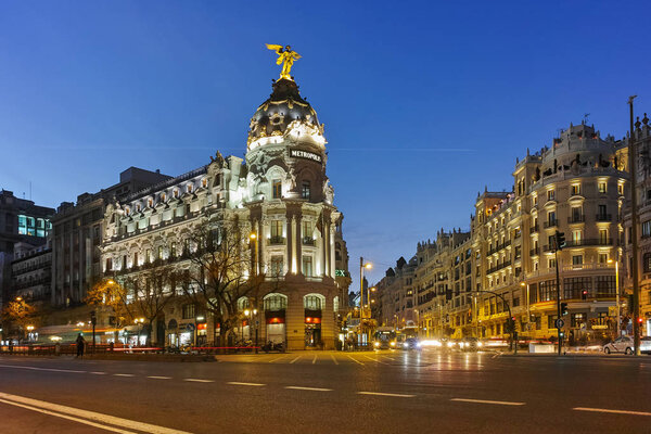 MADRID, SPAIN - JANUARY 23, 2018: Sunset view of Gran Via and Metropolis Building in City of Madrid, Spain