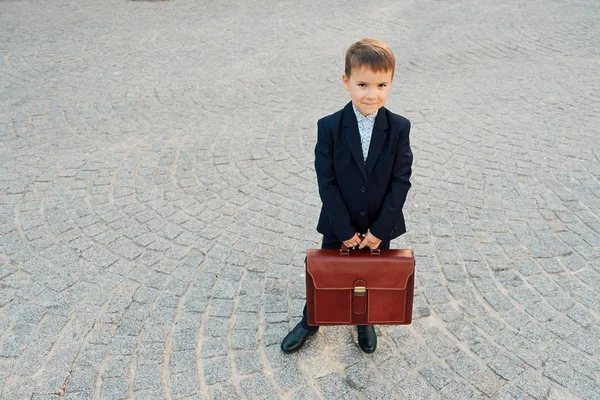 Future businessman in formal costume with briefcase — Stock Photo, Image