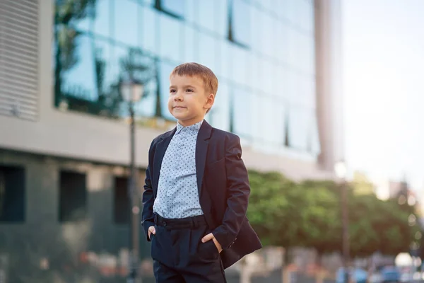 Boy in classic modern dark blue business costume — Stock Photo, Image