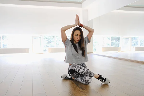 Young attractive woman practicing yoga