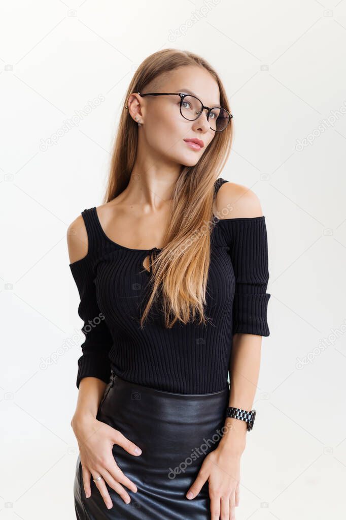 Elegant smiling woman in eyeglasses on white background