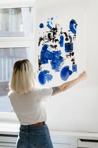 Blonde Caucasian Woman Placing Abstract Black Phantom Blue Paint Wall — Stock Photo, Image