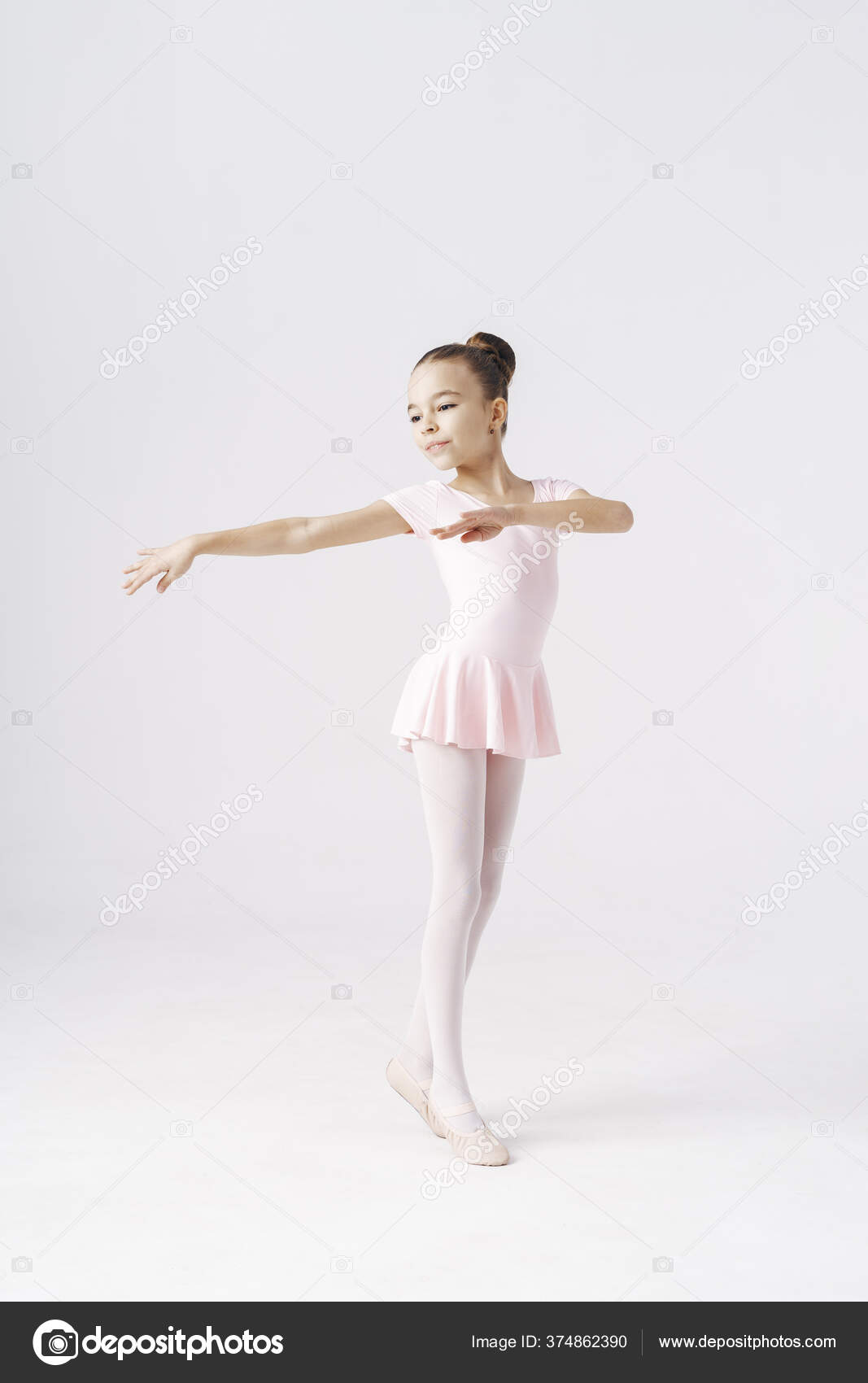Adorable pre teen ballerina dancing on white background Stock Photo diignat 374862390