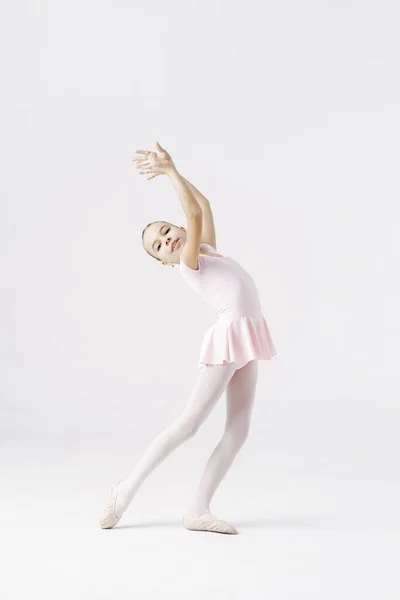 Adorable pre-teen ballerina dancing on white background — Stock Photo, Image