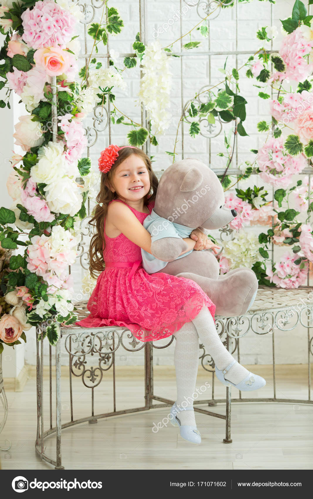 Smiling Beautiful Baby Girl In A Red Dress On A Background Of A Decor Of Flowers Stock Photo Image By C Zoom01 171071602