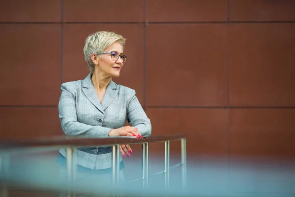 beautiful stylish woman with a short haircut in a suit