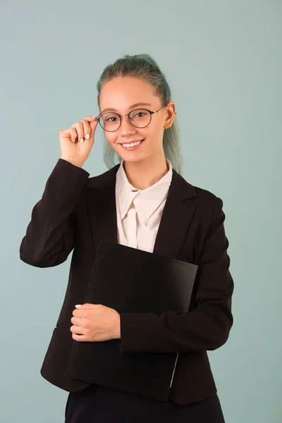 Beautiful Young Woman Glasses Black Suit Blue Background Folder Her — Stock Photo, Image