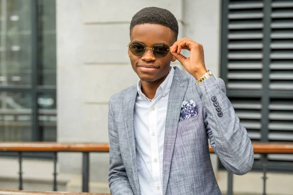 handsome young african man in a suit