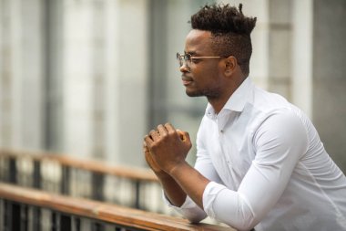 handsome young african man in a white shirt
