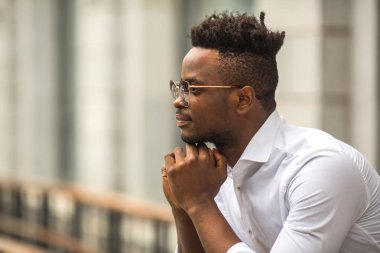 handsome young african man in a white shirt