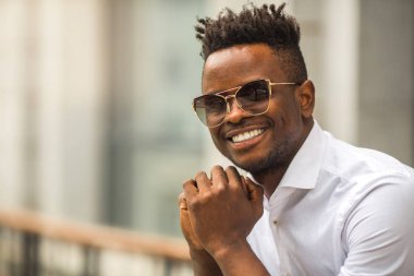 handsome young african man in a white shirt