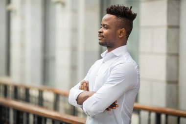 handsome young african man in a white shirt