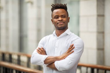 handsome young african man in a white shirt