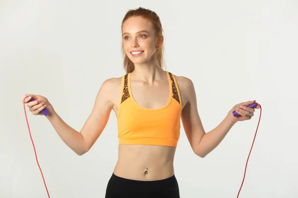 Beautiful Young Slim Woman Red Hair Sportswear White Background Skipping — 스톡 사진