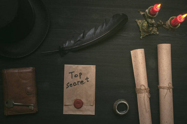 Top secret message document. Forbidden information. Detective agent desk table concept background. Secret agreement. The key to unraveling.