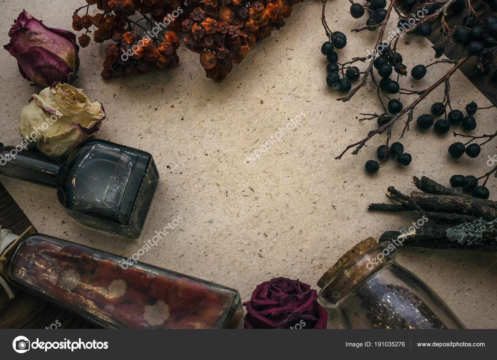 Witchcraft background with copy space. Magic potions and dried herbs on a  witch doctor table. Stock Photo
