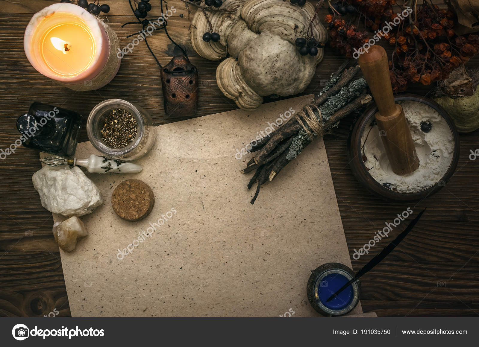 Witchcraft background with copy space. Magic potions and dried herbs on a  witch doctor table. Stock Photo