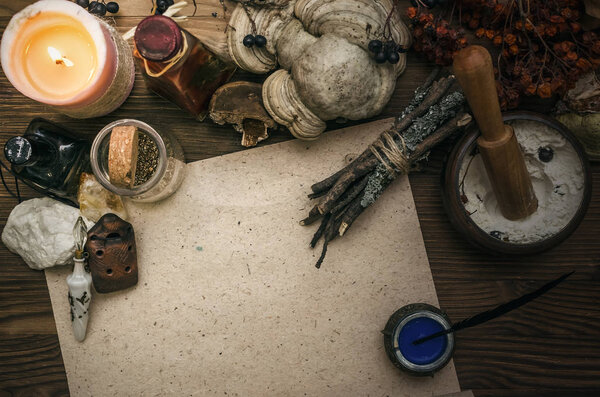 Ancient magic scroll paper sheet with copy space. Witchcraft. Witch doctor desk table. Magic potion. Alternative medicine concept.