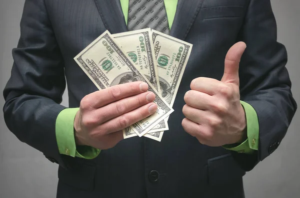 Hombre Negocios Sosteniendo Las Manos Dólares Dinero Mostrando Gesto Pulgares —  Fotos de Stock