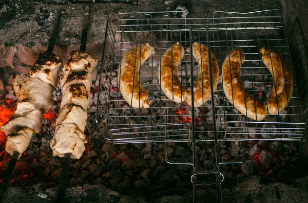 Barbecue meat steaks on the grill with flames. Meat on the coals. barbecue vacation concept close up.