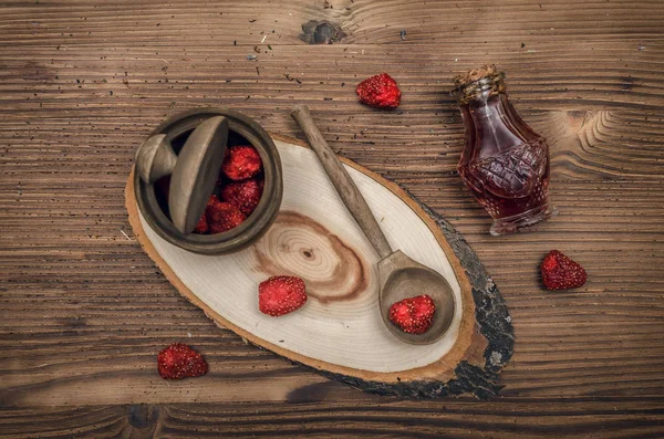 Herbal Medicine Concept Dry Strawberry Jar Strawberry Essential Oil Wooden — Stock Photo, Image
