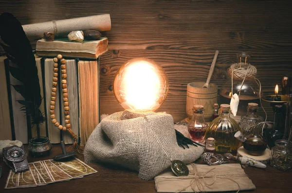 Crystal ball and tarot cards on fortune teller desk. Future reading concept. Paranormal magic table.