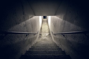 Staircase in the tunnel at night clipart
