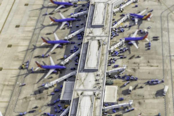 Airport terminal aerial view with planes. Tilt shift effect — Stock Photo, Image