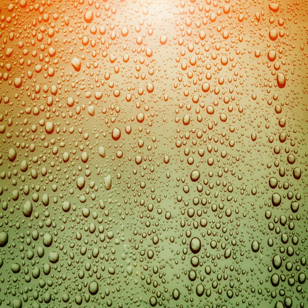 Krople wody na szkle z Flara obiektywu — Zdjęcie stockowe