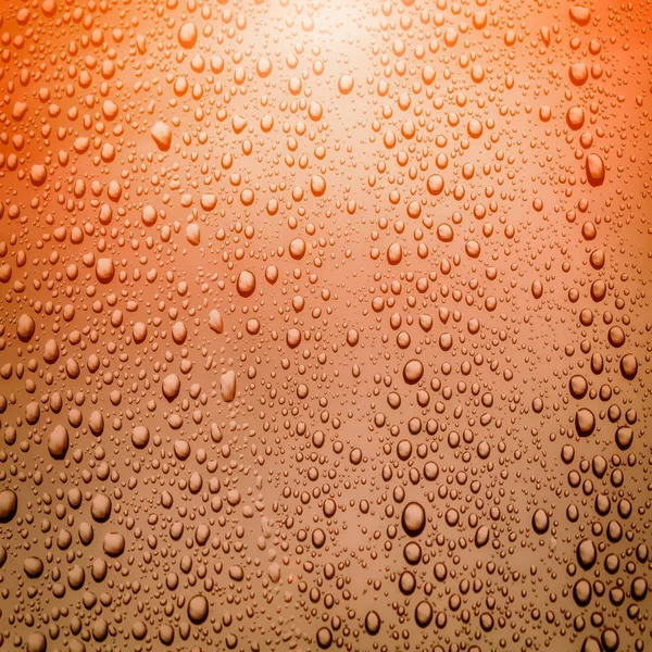 Gotas de agua en vidrio con destello de lente —  Fotos de Stock