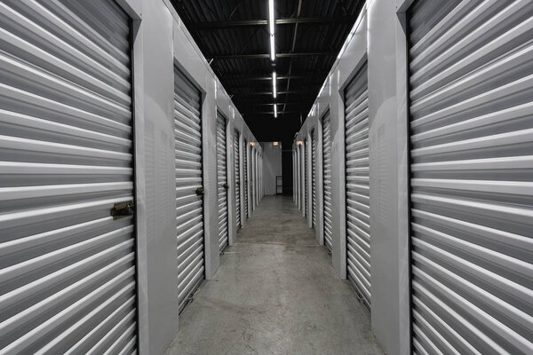 Storage warehouse interior. Metal garage doors with locks