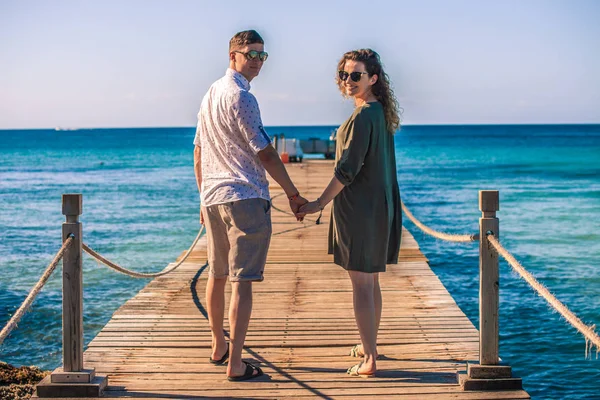 Engaged couple on the pier 8