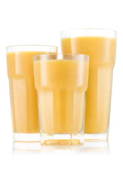 Mango, ananas, banan och melon smoothie i tre storleken av glas — Stockfoto