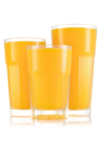 Apelsinjuice i tre storleken av glas — Stockfoto