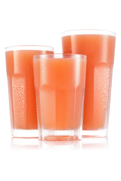 Grapefruktjuice i tre storleken av glas — Stockfoto