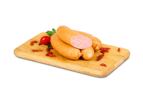 Sausage on wooden plate with spices and cutlery — Stock Photo, Image