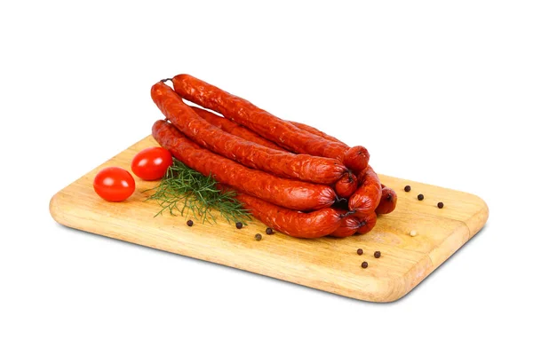 Sausage on wooden plate with spices and cutlery — Stock Photo, Image