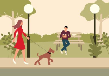 Parkta yürüyen kadın ve teriyer köpeği.