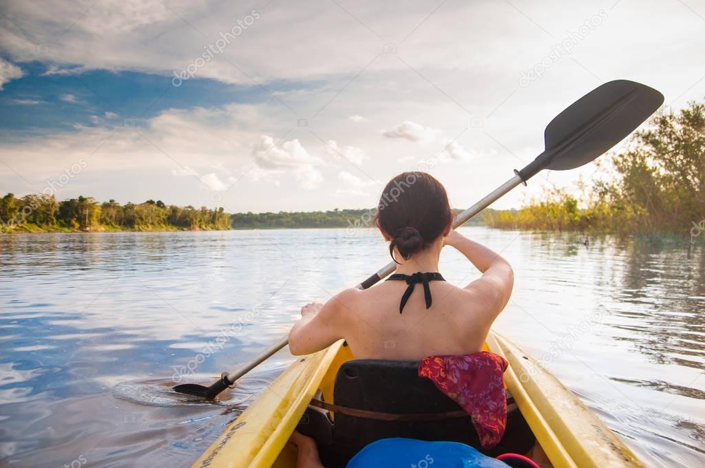 woman with kayak on the Amazon