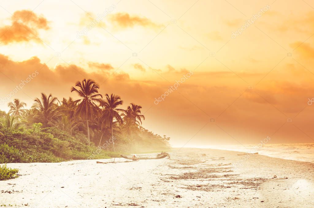 Sunset over tropical beach by Palomino in Colombia